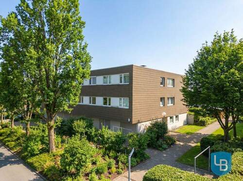 Gebäudeansicht - Viel Platz! Großzügige Eigentumswohnung mit Loggia und Garage in Kiel-Elmschenhagen