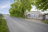 WWW.BOUWENS.DE - Vielseitige Lagerhalle mit großer Parkplatzfläche in Selfkant-Tüddern zur Miete!