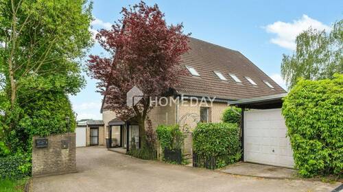 Außenansicht 2 - Großzügige Erdgeschosswohnung mit Gartenidylle und Komfort im Zweifamilienhaus