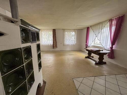 Wohnbereich mit Kachelofen - 