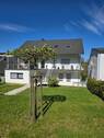 Außenansicht - Renovierte DG-Wohnung mit Einbauküche und schönem Garten