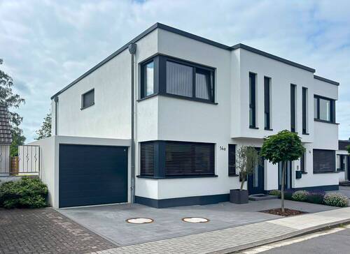 Hausansicht - Energieeffiziente Neubau-Doppelhaushälfte mit moderner Ausstattung