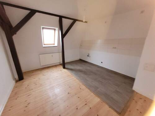 Einblick Wohnbereich mit offener Küche Bild 5 - 