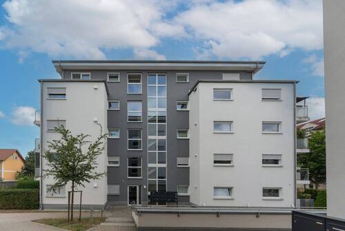 Gebäudeansicht - Bezugsfreie 4 Zimmer Wohnung mit Aufzug und Tiefgarage