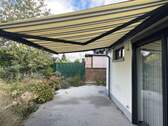 Terrasse mit elektrischer Markise - Reihenmittelhaus mit 126,00 m&sup2; in Wegberg-Harbeck zum Kaufen