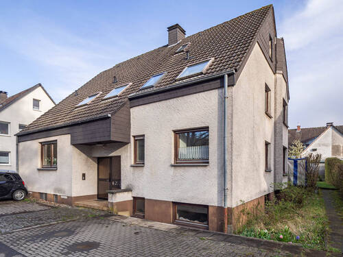 Außenansicht - Langfristig vermietetes Mehrfamilienhaus in naturnaher Umgebung in Menden!