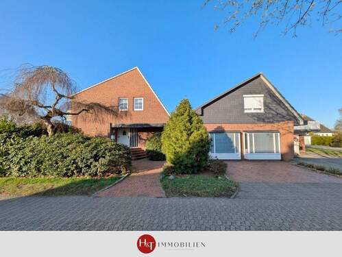 Haus kaufen in Weyhe Erichshof - Hechler & Twachtmann Immobilien GmbH - Familienidyll mit Vermietungspotenzial in Weyhe-Erichshof!