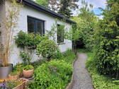 Weg zum hinteren Garten - Einfamilienhaus mit 105,00 m&sup2; in Deutsch Evern zum Kaufen