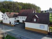 Frontansicht - 1 Zimmer Mehrfamilienhaus, Wohnhaus zum Kaufen in Kottweiler-Schwanden