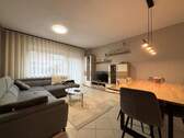 Wohnzimmer - Terrassenwohnung mit 65,60 m² in Harsefeld zum Kaufen