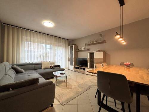 Wohnzimmer - Terrassenwohnung mit 65,60 m² in Harsefeld zum Kaufen