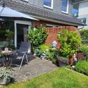 Ansicht Garten und Terrasse - 3 Zimmer-Mittelhauswohnung auf 2 Etagen