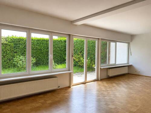 Wohnzimmer - Charmante Doppelhaushälfte mit Garten in begehrter Lage von München