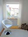 Sessel mit Blick in grünen Hof - 1 Zimmer Etagenwohnung in Mannheim
