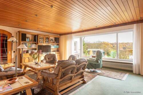 Wohnzimmer mit Zugang zur Terrasse - 