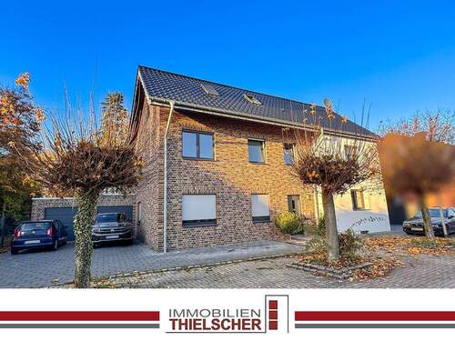 1.2 Titelbild - Attraktives Zweifamilienhaus mit angrenzender Doppelhaushälfte, Stellplatz und zwei Garagen