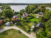 Bild 1 - Wohnen, wo andere Urlaub machen - Grundstück mit Seenähe und freiem Feldblick