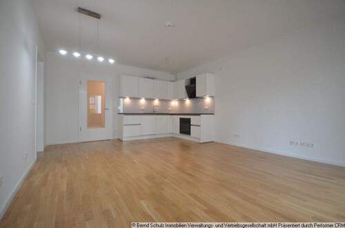 05 Wohnzimmer mit offener Küche - 