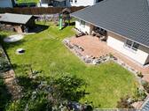 Blick auf den Garten - Einfamilienhaus mit 113,00 m&sup2; in Wriezen zum Kaufen