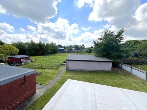 Blick von der Loggia - Einfamilienhaus mit 137,90 m&sup2; in Lütjenwestedt zum Kaufen