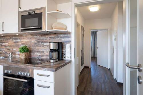 Von der Küche in den Flur - Terrassenwohnung mit 54,00 m² in Pelzerhaken zum Kaufen