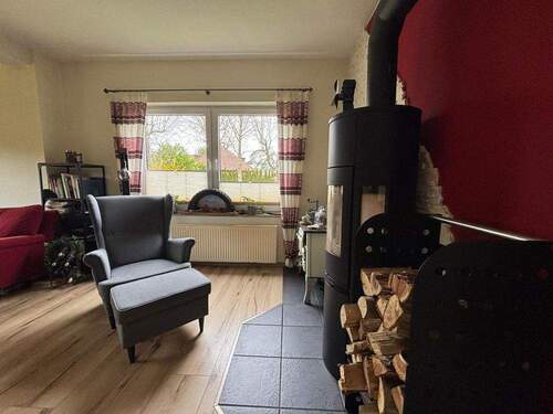 Wohnzimmer - Einfamilienhaus mit 101,00 m² in Butjadingen / Burhave zum Kaufen