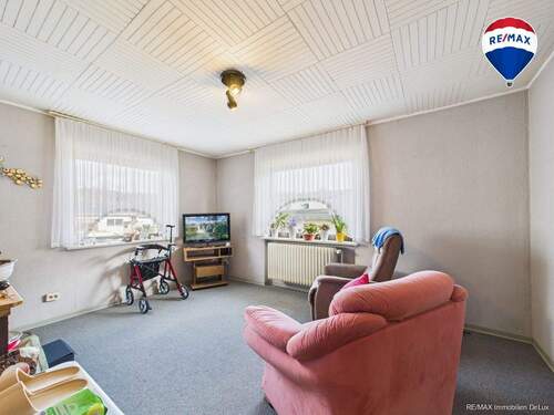 RE/MAX Immobilien DeLux Einfamilienhaus Merzig-Besseringen Wohnzimmer - 