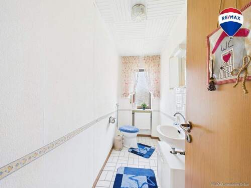 RE/MAX Immobilien DeLux Einfamilienhaus Merzig-Besseringen Gäste-WC - 