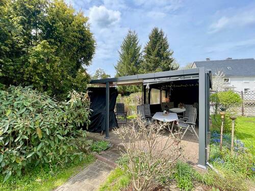 Überdachte Terrasse mit Kamin - 