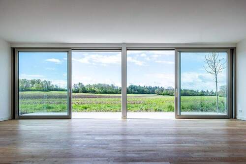 Ausblick Wohnzimmer - 7 Zimmer Einfamilienhaus zum Kaufen in Gräfelfing
