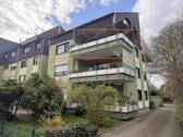 Außenansicht - Hier wird für Sie renoviert: ca. 65 m² Wohnung mit großer Loggia, Garage & gepflegtem Wohnumfeld