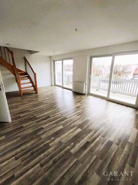 Wohnzimmer - Großzügige Maisonette-Wohnung mit Balkon!