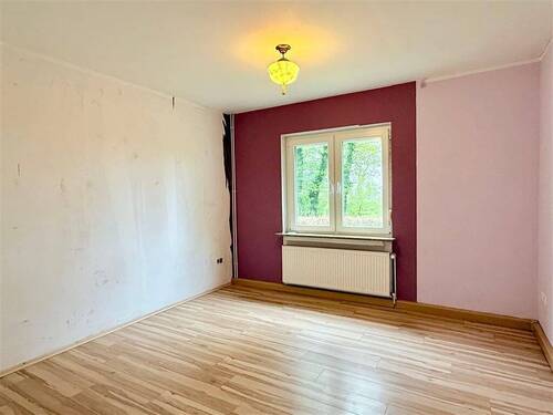 Schlafzimmer - Mehrfamilienhaus, Wohnhaus mit 85,00 m&sup2; in Großefehn zum Kaufen