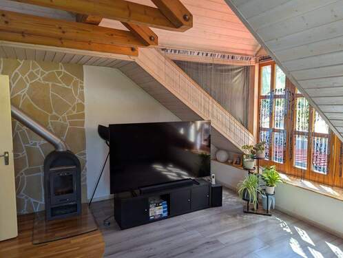 Wohnzimmer mit Kaminofen - 