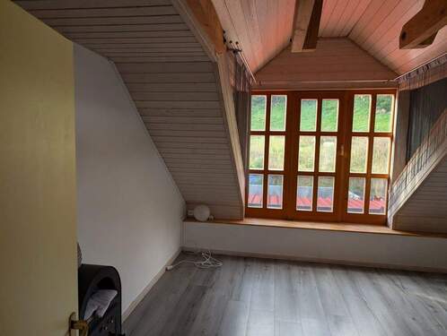 Wohnzimmer mit großer Gaube - 