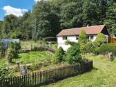 Blick auf den Bungalow - Einfamilienhaus mit 78,00 m² in Bad Gottleuba-Berggießhübel / Hellendorf zum Kaufen