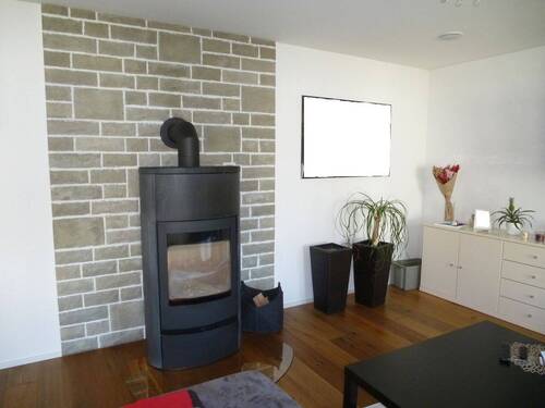 Kaminofen im Wohnzimmer - Einfamilienhaus mit 128,00 m² in Reutlingen zum Kaufen