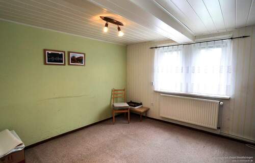 Wohnzimmer EG - 4 Zimmer Einfamilienhaus zum Kaufen in Kammerforst