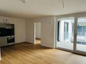 Wohnbereich mit Küche - Moderne 2-Zimmer-Neubauwohnung mit Balkon!