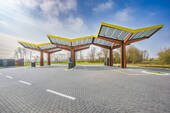Bild 1 - Nachhaltiges Investment in Düren! Langfristig vermietetes Grundstück mit moderner Schnellladestation