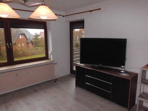 Wohnbereich mit Zugang zu Loggia - Etagenwohnung mit 58,00 m&sup2; in Friedrichskoog zum Kaufen