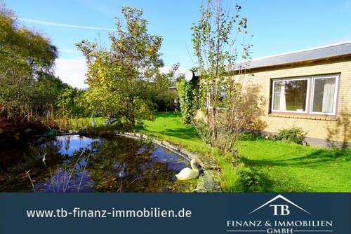 Bild 1 - Burhafe: Stilvoller Flachdachbungalow mit Blick ins Grüne! #212