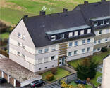 Peter Dondorf Immobilien - Mehrfamilienhaus mit Garagen und Stellplätzen in Stolberg-Büsbach