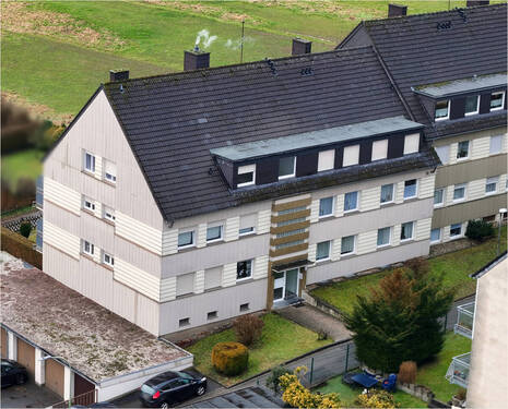 Peter Dondorf Immobilien - Mehrfamilienhaus mit Garagen und Stellplätzen in Stolberg-Büsbach
