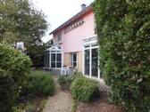 Rückseite mit Blick auf Wintergarten - Einfamilienhaus mit 250,00 m² in Mettendorf zum Kaufen