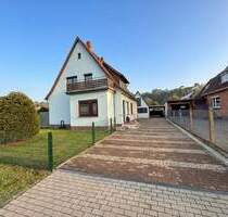 Dörverden: Teilvermietetes Siedlungshaus mit Carport und Nebengebäude auf großem Gartengrundstück