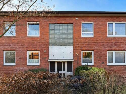 Ansicht Haus - Großzügige 3 bis 4-Zimmer-Wohnung mit Terrasse und Einzelgarage in guter Lage