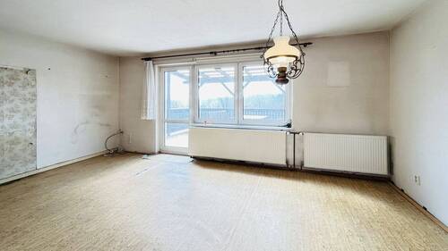 Wohnzimmer mit Zugang zum Balkon - Einfamilienhaus mit 116,00 m&sup2; in Wiendorf zum Kaufen