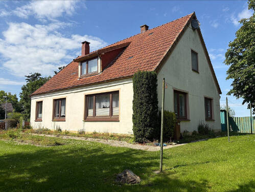 Bild1 - Einfamilienhaus mit Nebengebäude und großem Grundstück in Butjadingen-Tossens