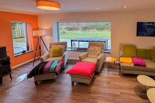 Wohnzimmer mit Kaminofen - 3 Zimmer Einfamilienhaus in Maasholm